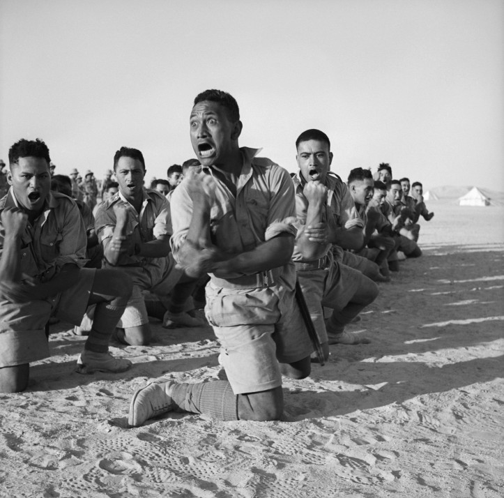 A Māori battalion performing a haka for the King of Greece in Helwan, Egypt, 25th June 1941. National Library of New Zealand